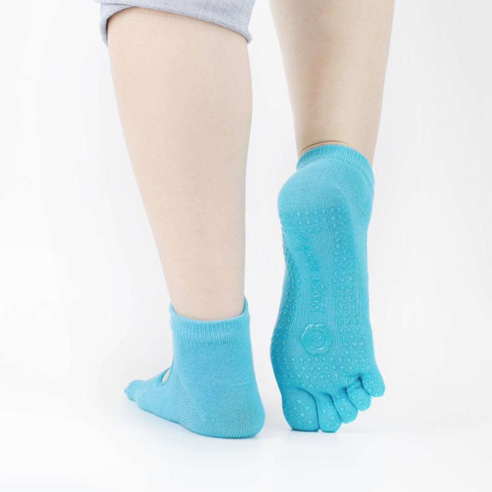 Chaussettes de yoga creuses en tissu élastique à cinq orteils